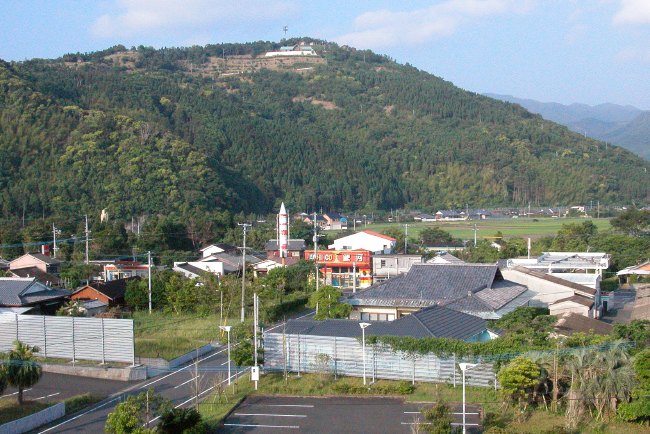 A small rural Japanese town, with an aging pachinko parlor in the center (96K JPEG)