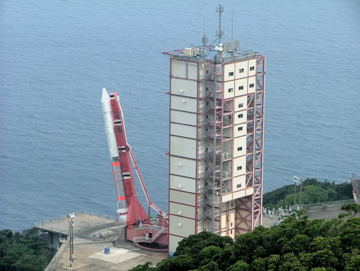 The rocket, tilted at a jaunty 12 degrees from vertical, hangs beside (and slightly below) the launcher rail.   (95K JPEG)