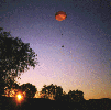 payload descends at sunset