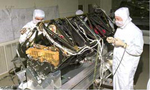 photo of people working on STIS instrument in clean room